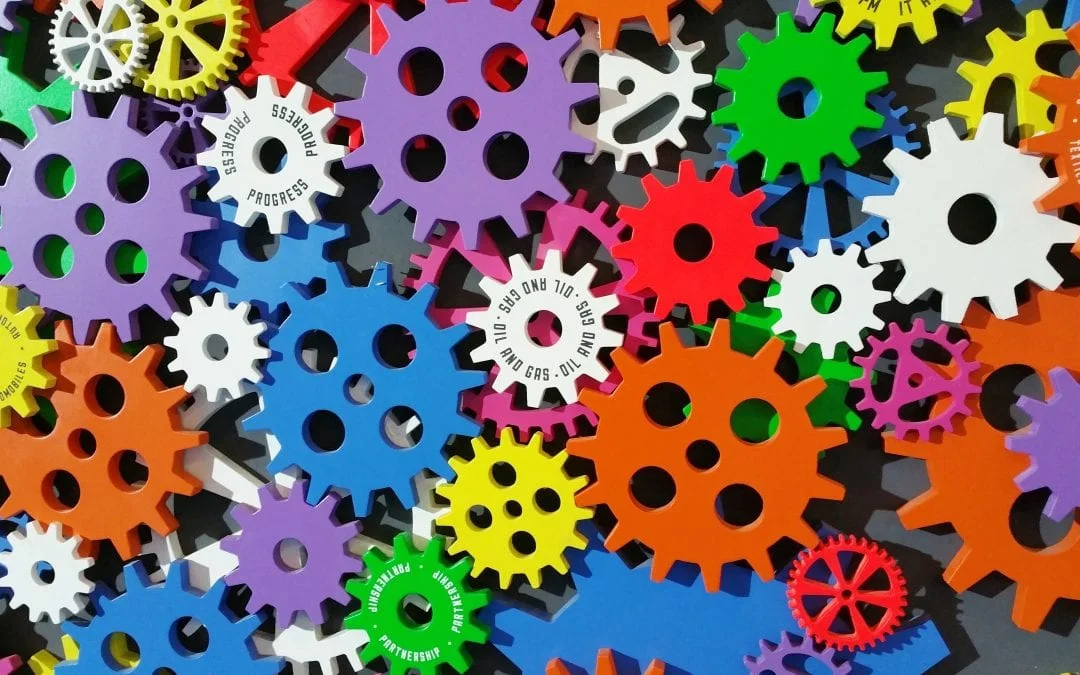 A set of colorful gears used for piston replacement stage